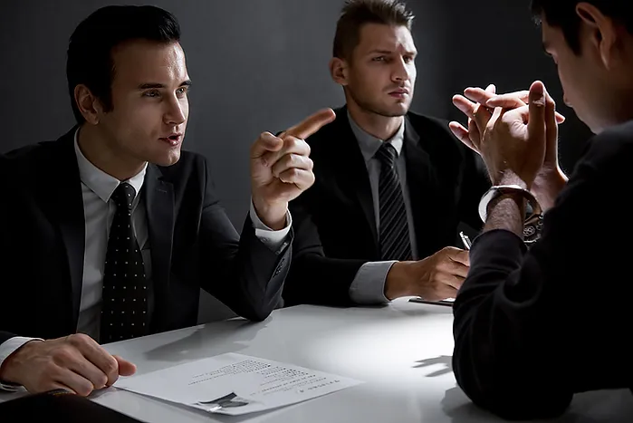 Image of men at table discussing probation