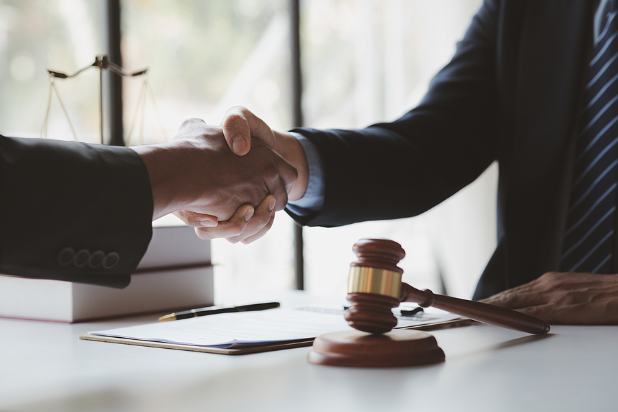 Lawyers Shake Hands With Clients Who Come To Testify In The Case